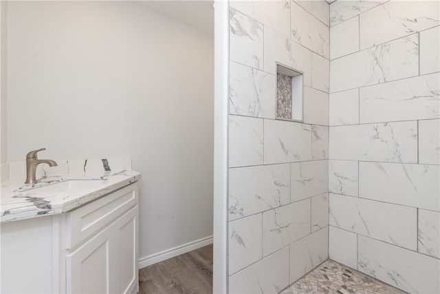 bathroom featuring vanity and hardwood / wood-style flooring