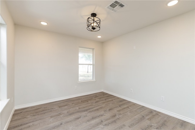 spare room featuring light wood-type flooring