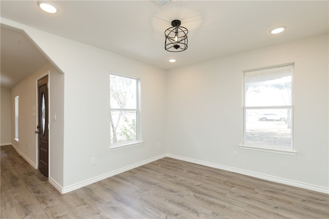 unfurnished room with light hardwood / wood-style floors