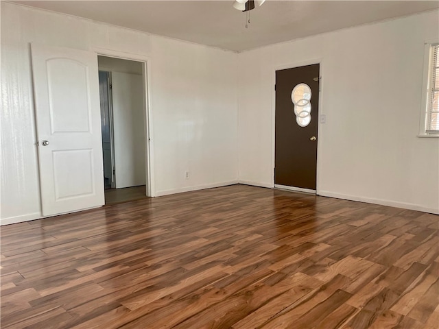104 E Refugio St, Skidmore, TX 78389 - entrance foyer featuring dark wood finished floors and a ceiling fan