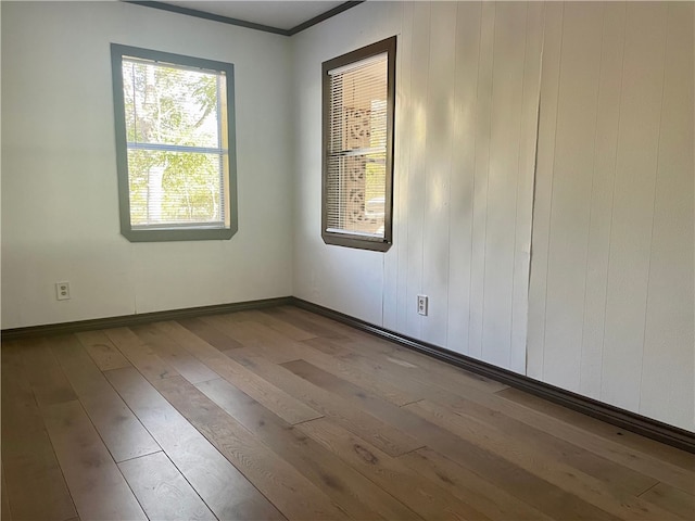 104 E Refugio St, Skidmore, TX 78389 - unfurnished room featuring wood-type flooring and crown molding