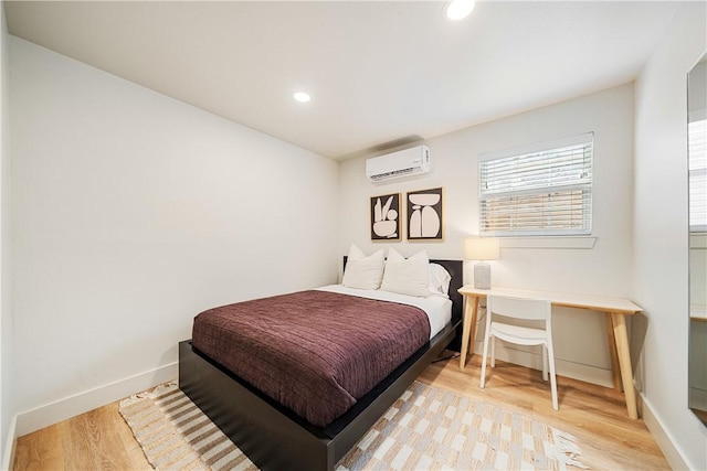 934 Miramar Pl, Corpus Christi, TX 78411 - bedroom with a wall mounted AC, light wood-type flooring, baseboards, and recessed lighting