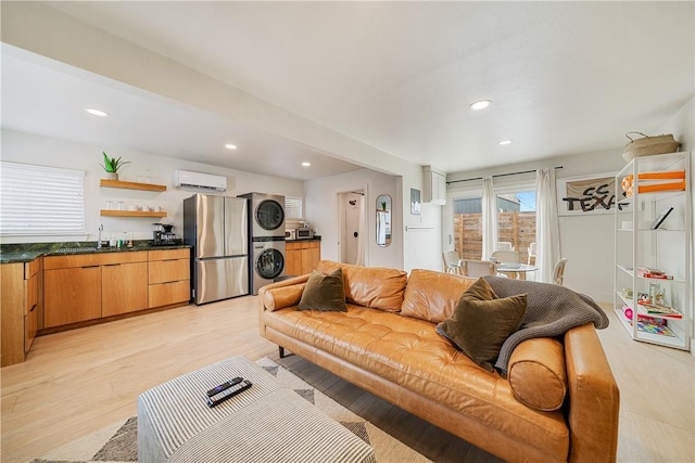 934 Miramar Pl, Corpus Christi, TX 78411 - living area featuring stacked washer / drying machine, light wood finished floors, recessed lighting, an AC wall unit, and bar
