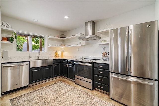 934 Miramar Pl, Corpus Christi, TX 78411 - kitchen with open shelves, stainless steel appliances, wall chimney range hood, a sink, and dark cabinetry