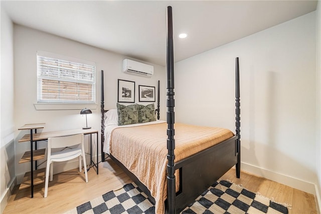 934 Miramar Pl, Corpus Christi, TX 78411 - bedroom featuring a wall mounted AC, baseboards, light wood finished floors, and recessed lighting