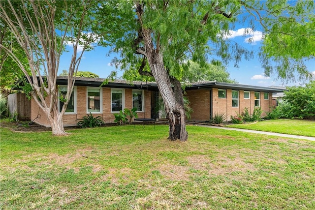 934 Miramar Pl, Corpus Christi, TX 78411 - ranch-style house with a front yard and brick siding