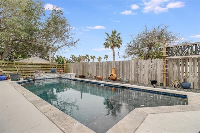 view of swimming pool featuring a fenced in pool and a fenced backyard