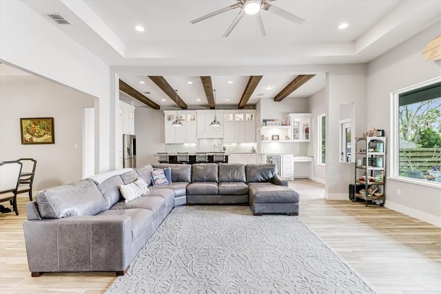 living area with visible vents, ceiling fan, recessed lighting, and light wood-style flooring