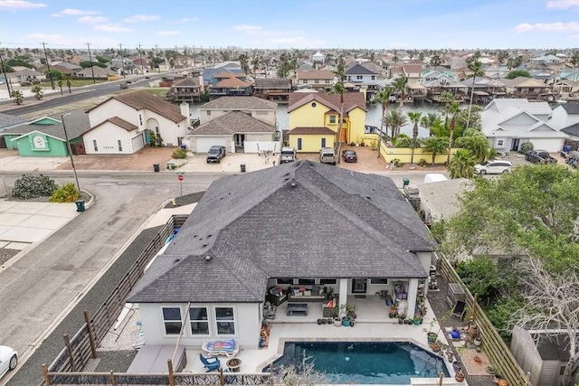 birds eye view of property with a residential view