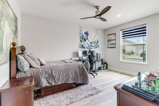 bedroom with recessed lighting, ceiling fan, wood finished floors, and baseboards