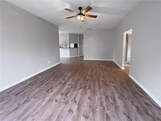 unfurnished living room featuring hardwood / wood-style floors and ceiling fan