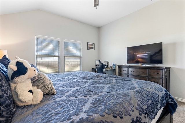 carpeted bedroom featuring vaulted ceiling