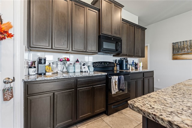 kitchen with black appliances, light stone counters, dark brown cabinetry, and light tile patterned flooring