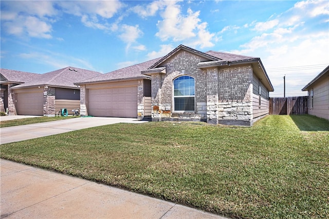 view of front of house with a garage and a front lawn