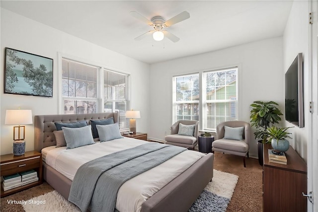 carpeted bedroom with a ceiling fan