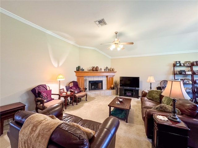 living room with ornamental molding, ceiling fan, carpet flooring, a fireplace, and lofted ceiling