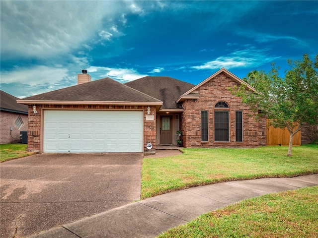 view of front of home with a garage and a front yard