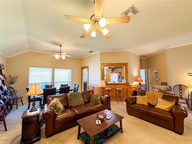 carpeted living room with ceiling fan, lofted ceiling, and ornamental molding