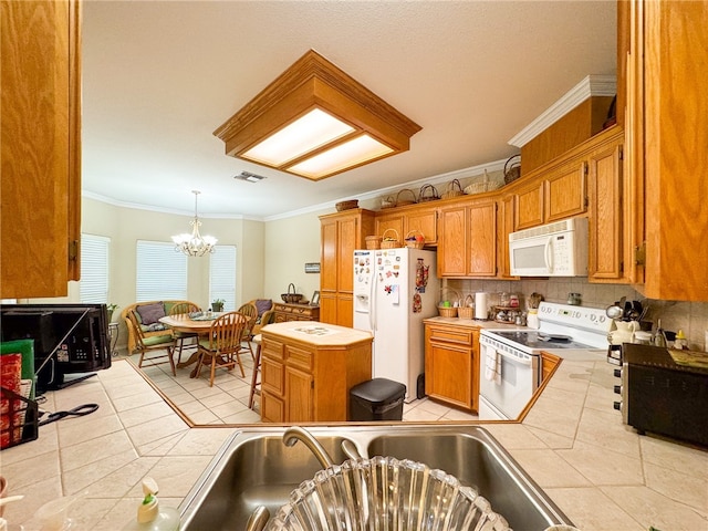 kitchen featuring light tile patterned floors, an inviting chandelier, white appliances, crown molding, and pendant lighting