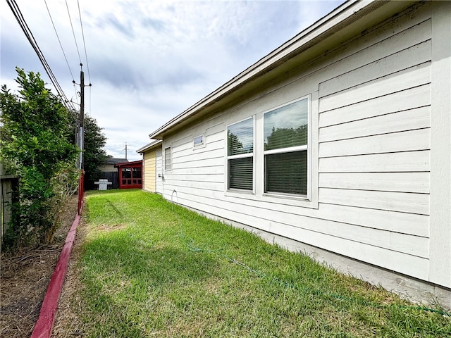 view of property exterior featuring a yard