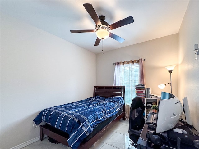 tiled bedroom with ceiling fan