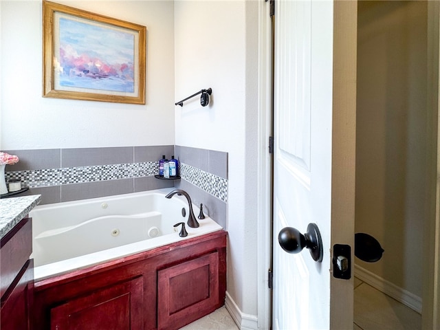 bathroom featuring a bath and vanity