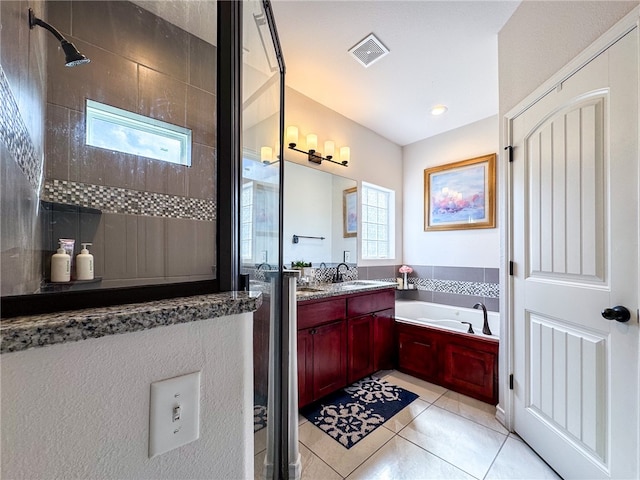 bathroom with vanity, tile patterned flooring, a healthy amount of sunlight, and separate shower and tub