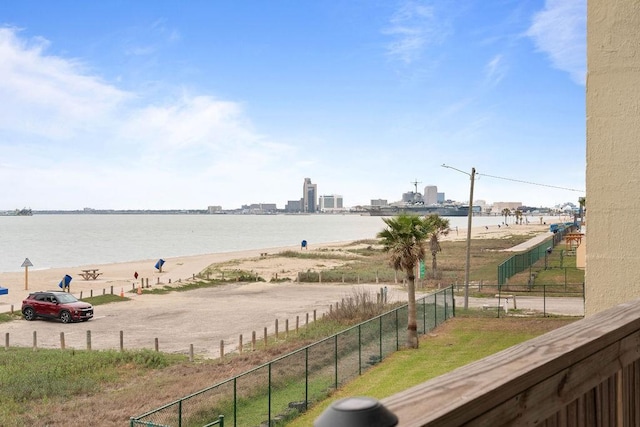 property view of water featuring fence