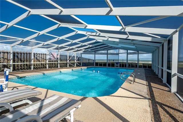 view of pool with a fenced in pool, a lanai, and a patio area