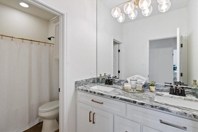 full bathroom featuring hardwood / wood-style flooring, vanity, toilet, and shower / bath combo