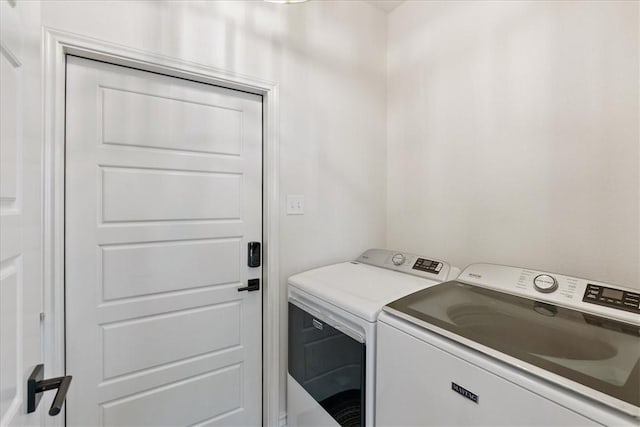 washroom with washer and clothes dryer