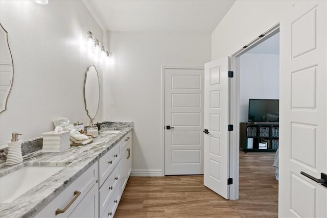 bathroom featuring hardwood / wood-style flooring and vanity