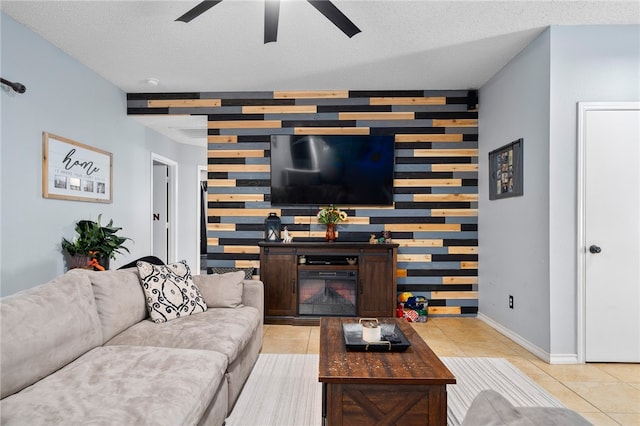 living room featuring light tile patterned floors and a textured ceiling