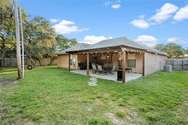 back of property featuring a yard, a patio, and central AC unit