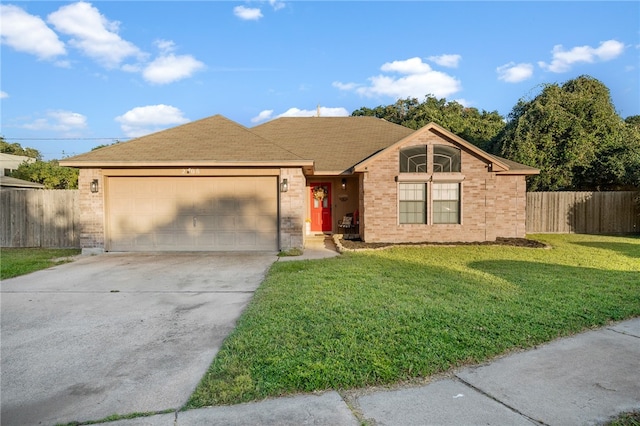 ranch-style home with a front yard and a garage