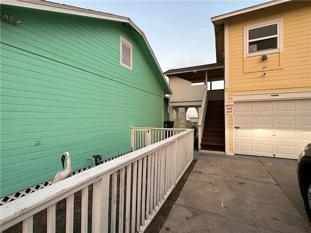 view of side of home with a garage