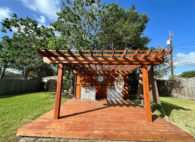 wooden deck featuring a pergola and a yard