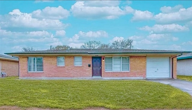 single story home with a garage and a front yard