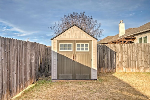 view of outbuilding with a yard