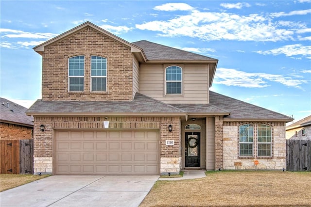 view of front property with a garage and a front yard