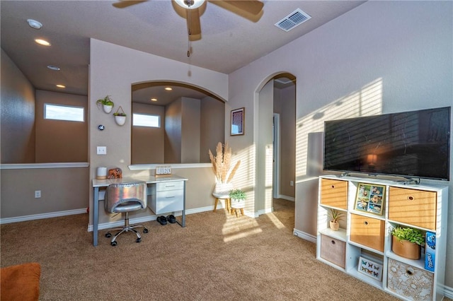 office featuring light carpet and ceiling fan