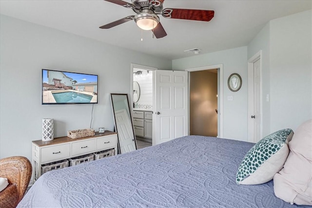 bedroom with ensuite bath and ceiling fan