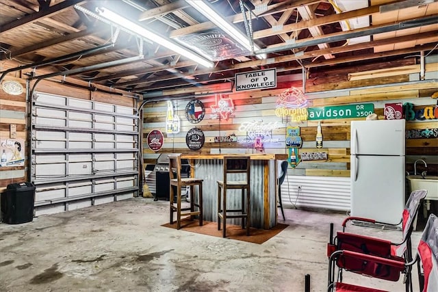 garage with white refrigerator