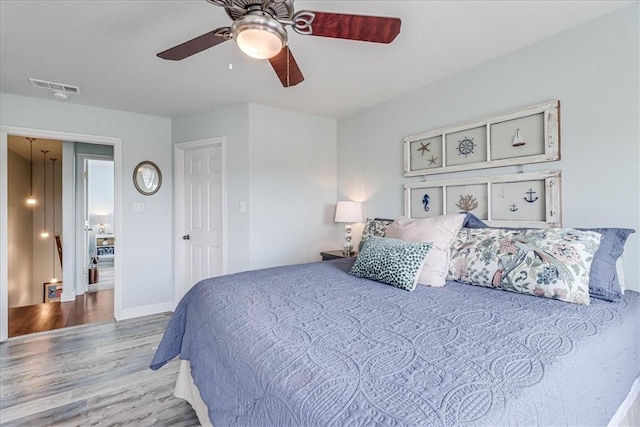 bedroom with ceiling fan and hardwood / wood-style flooring