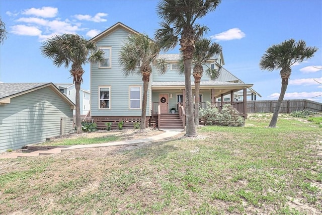 view of front of property featuring a front lawn and covered porch