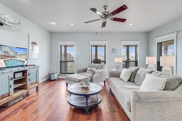 living room with hardwood / wood-style floors and ceiling fan