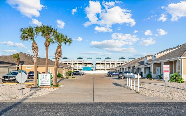 14915 Island Village Dr, Corpus Christi, TX 78418 - view of concrete road featuring a residential view and traffic signs
