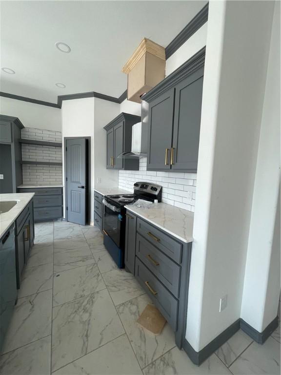 kitchen featuring marble finish floor, black appliances, ornamental molding, decorative backsplash, and light stone countertops