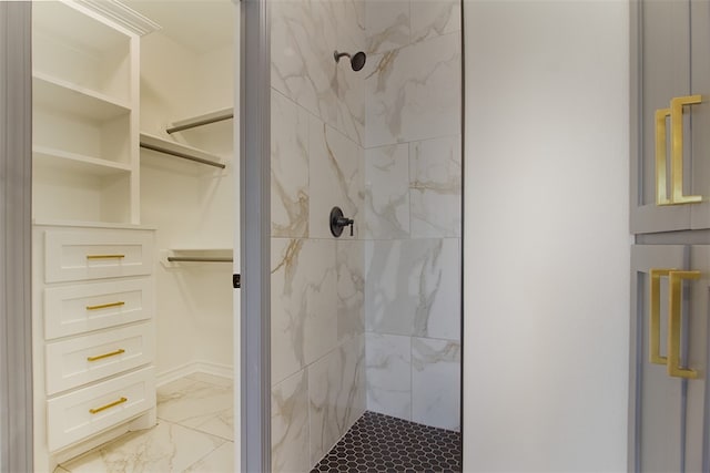 3633 Rebecca Dr, Corpus Christi, TX 78410 - bathroom featuring a stall shower, marble finish floors, and a walk in closet