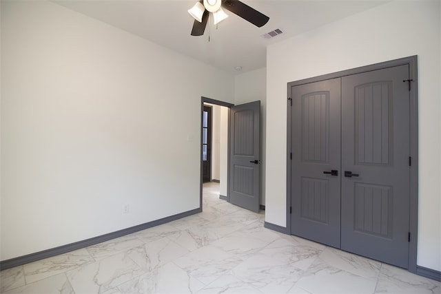 3633 Rebecca Dr, Corpus Christi, TX 78410 - unfurnished bedroom with light marble finish floors, baseboards, and a closet